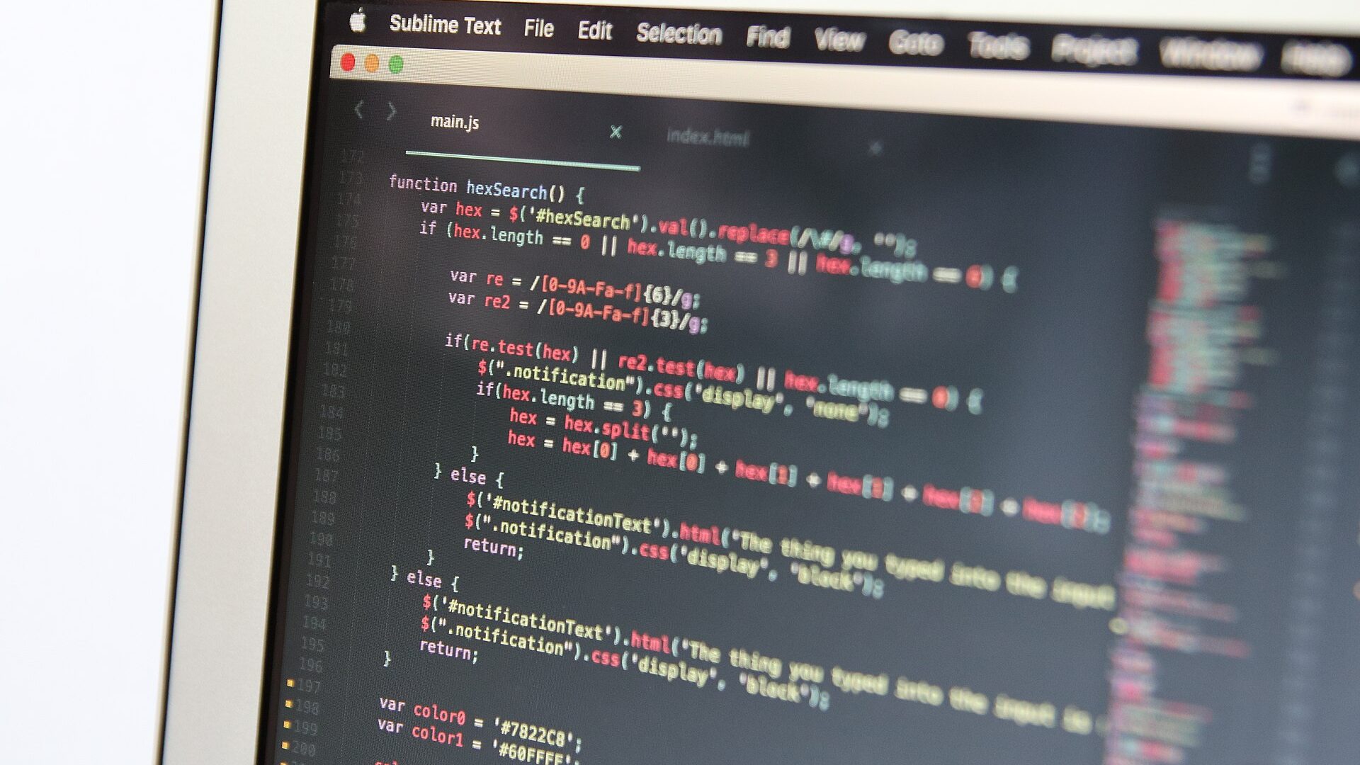 Macro close-up of code in a text editor on a laptop screen