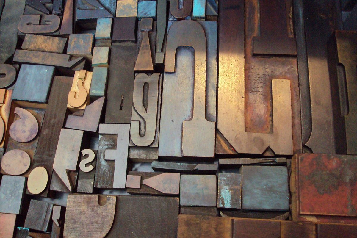 Close-up of vintage wood and metal letterpress type blocks