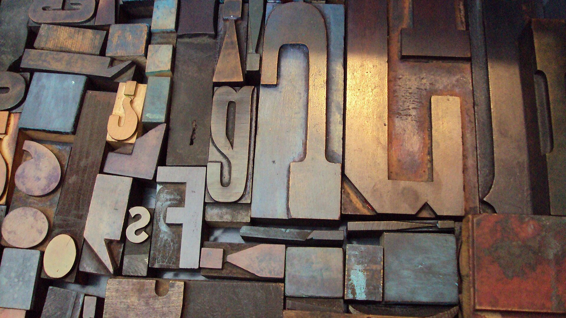 Close-up of vintage wood and metal letterpress type blocks